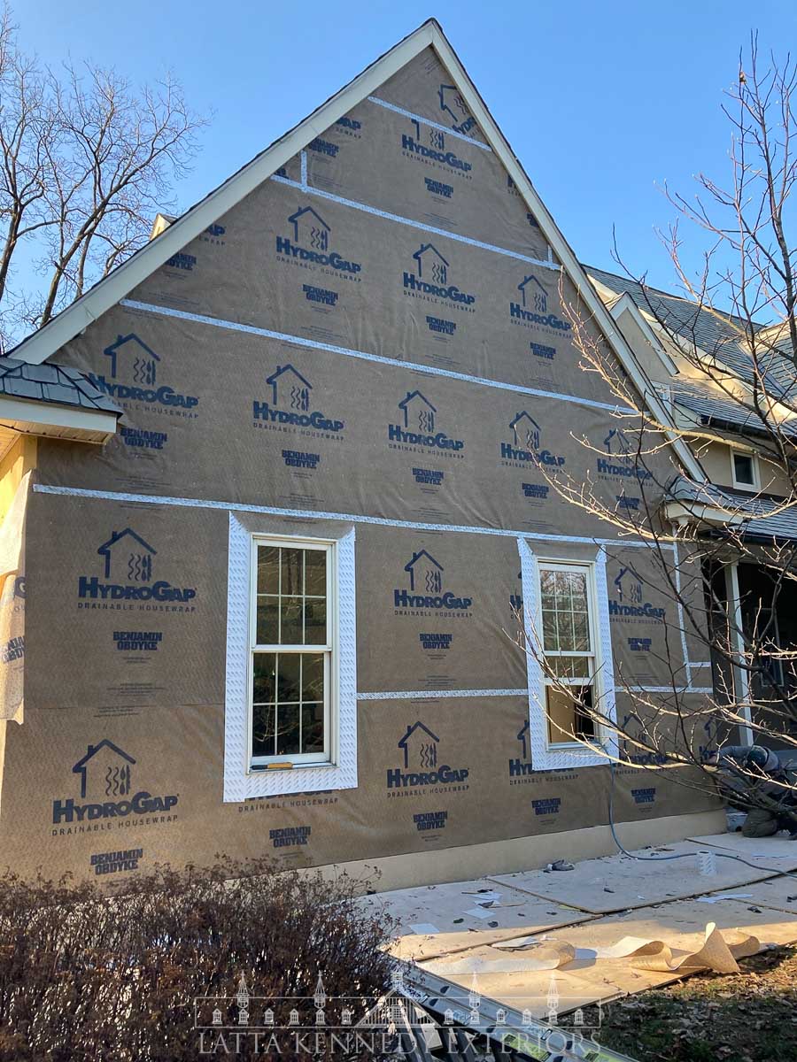 Here is the garage wall prepared and ready for Azek details and eventually Hardie. HydroGap was stapled and all seams were taped. 