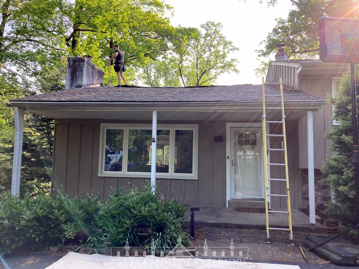 Here is a picture of the original, sagging roof. On the left of the roof, you can see an improper counter flashing at the left chimney.