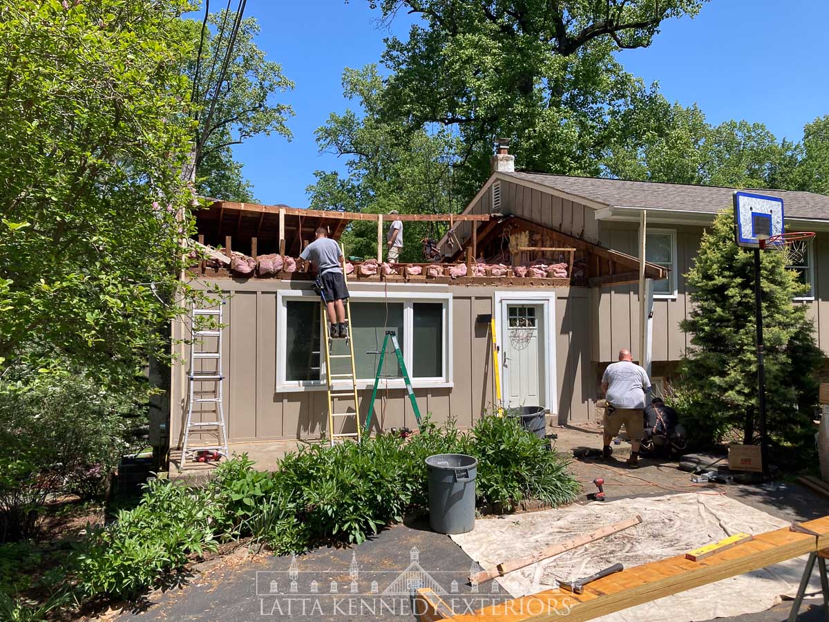 Controlled demolition of the roof, preparation for new structural framing, and new A-Frame Portico. 