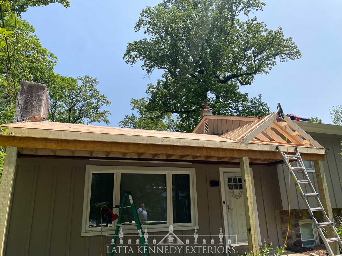 Entirely new framing, structural porch beam, new posts, new A-Frame and all new ½" Sheathing to new construction roof. 