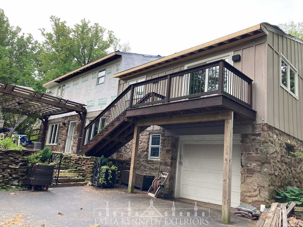 Rear of the home, mid-way through existing siding removal 