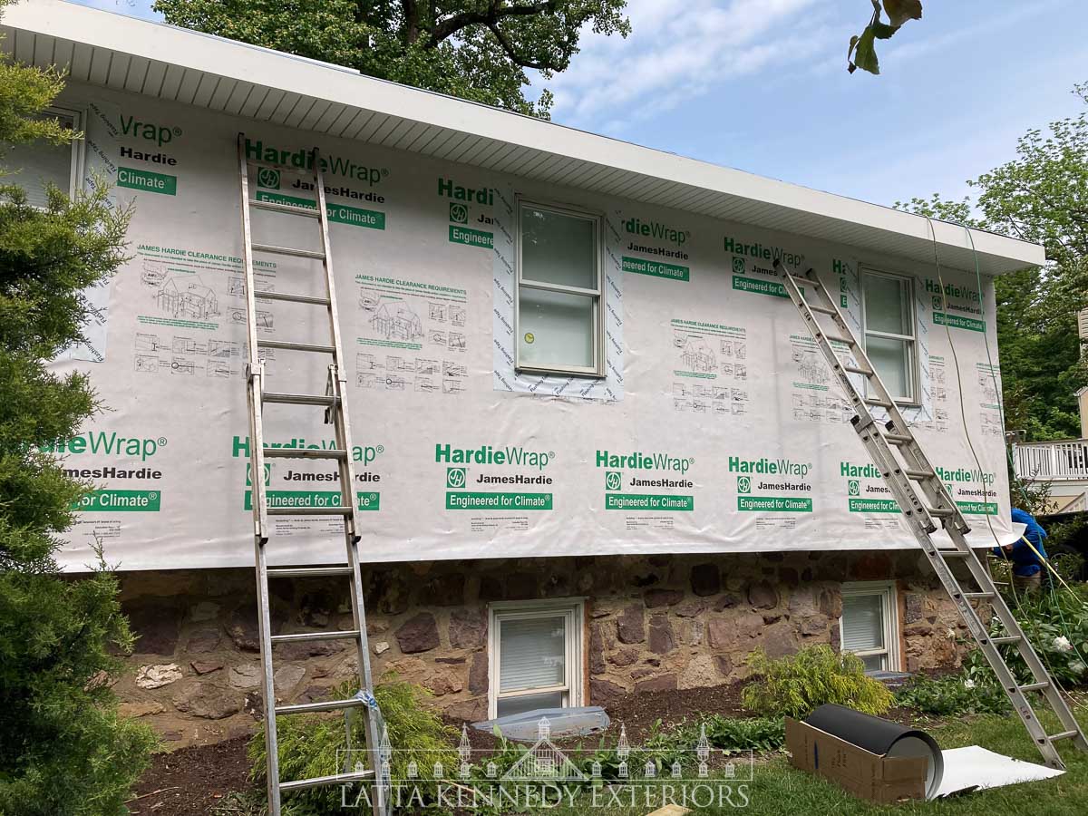 In preparation for Hardie siding, all new 3-1/3 CertainTeed Invisivent soffit installed as well as new Hardie House wrap and 6” Dupont Flashing tape and custom drip caps. 